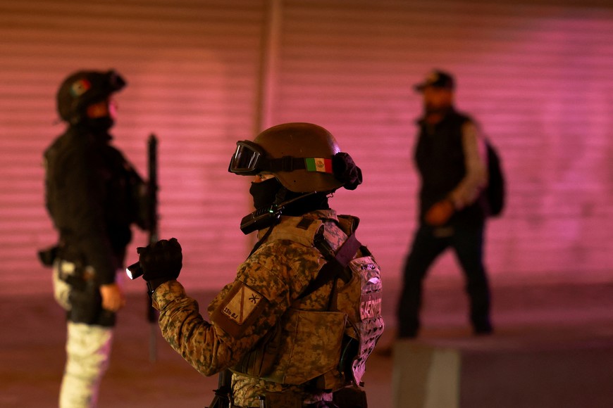 Members of the Mexican National Guard and the Mexican Army patrol at a checkpoint near a border crossing with the U.S. as part of the Mexican government's response to U.S. President Donald Trump's demand to crack down on immigration and drug smuggling, in Ciudad Juarez, Mexico, February 13, 2025. REUTERS/Jose Luis Gonzalez