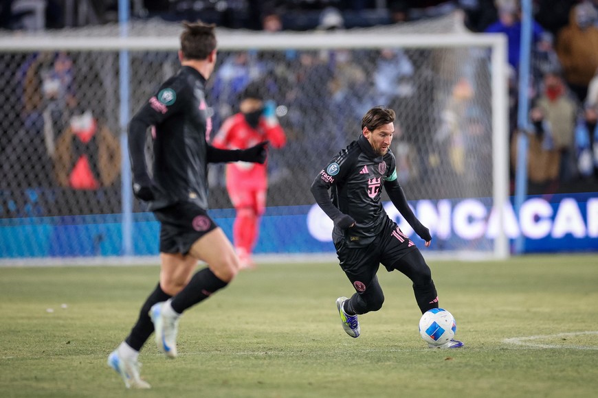 Feb 19, 2025; Kansas City, Kansas, USA; Inter Miami forward Lionel Messi (10) brings the ball up field during the first half against the Sporting Kansas City at Children's Mercy Park. Mandatory Credit: William Purnell-Imagn Images