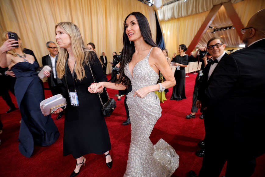 Demi Moore walks on the red carpet during the Oscars arrivals at the 97th Academy Awards in Hollywood, Los Angeles, California, U.S., March 2, 2025. REUTERS/Mike Blake