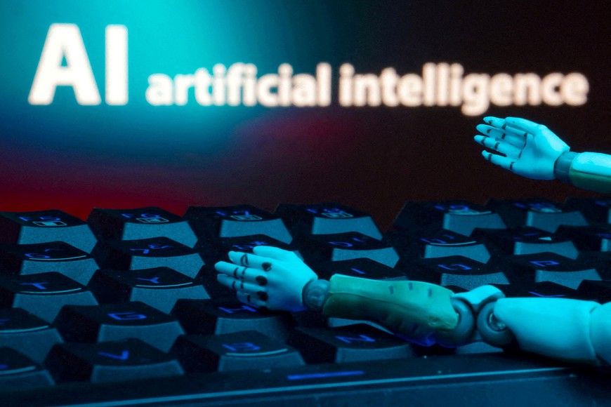 FILE PHOTO: A message reading "AI artificial intelligence", a keyboard, and robot hands are seen in this illustration taken January 27, 2025. REUTERS/Dado Ruvic/Illustration/File Photo