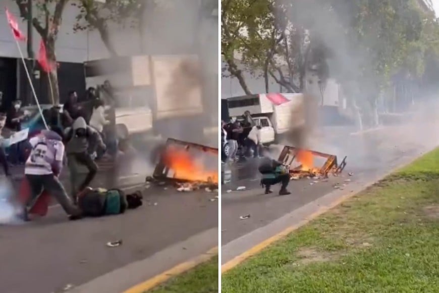 El momento en el cual cae Grillo y  la pose previa en la cual tomaba una fotografía en detalle de foco de fuego originado por manifestantes.