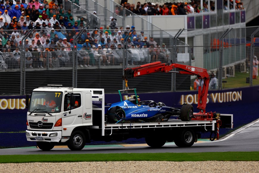 Formula One F1 - Australian Grand Prix - Albert Park Grand Prix Circuit, Melbourne, Australia - March 16, 2025
The car of Williams' Carlos Sainz Jr. is towed away by marshals after crashing out of the race REUTERS/Edgar Su
