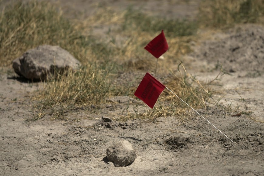 Evidence markers are seen during a media tour by Jalisco's Attorney General Office at Izaguirre Ranch, which activists have called a cartel-run "extermination camp," in Teuchitlan, Jalisco state, Mexico March 20, 2025. REUTERS/Ivan Arias