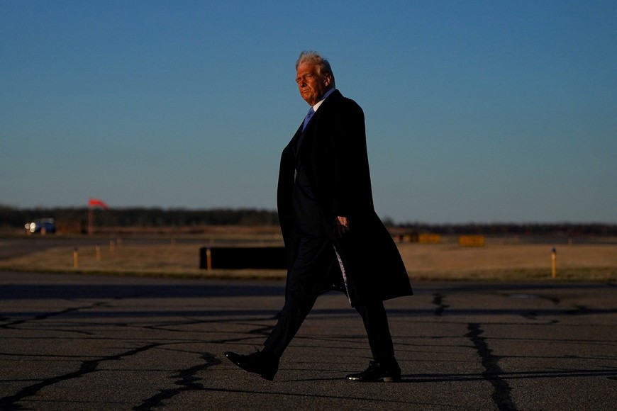 U.S. President Donald Trump walks at Morristown Municipal Airport in Morristown, New Jersey, U.S., March 21, 2025. REUTERS/Nathan Howard TPX IMAGES OF THE DAY