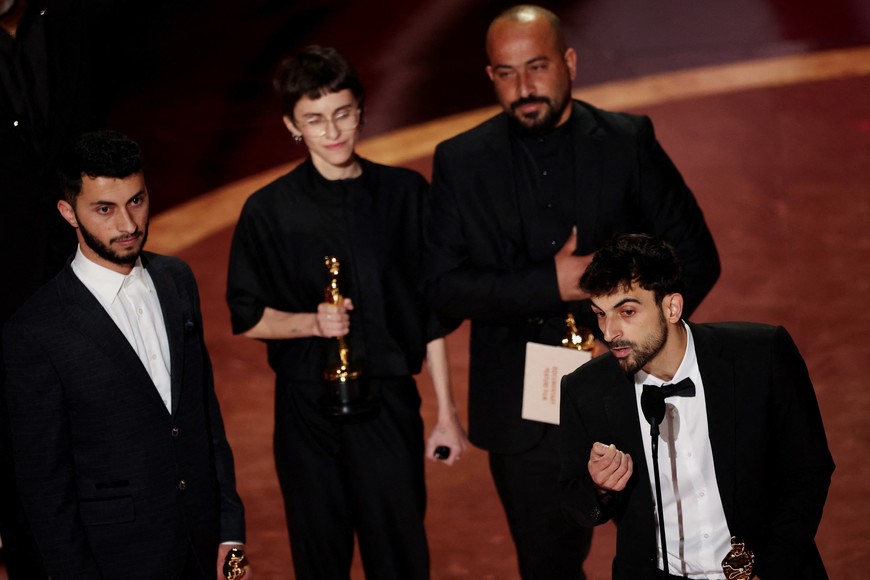Basel Adra, Rachel Szor, Hamdan Ballal and Yuval Abraham win the Oscar for Best Documentary Feature Film for "No Other Land" during the Oscars show at the 97th Academy Awards in Hollywood, Los Angeles, California, U.S., March 2, 2025. REUTERS/Carlos Barria