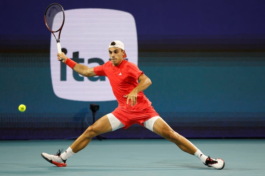 Mar 23, 2025; Miami, FL, USA; Francisco Cerundolo (ARG) reaches for a forehand against Tommy Paul (USA)(not pictured) on day six of the Miami Open at Hard Rock Stadium. Mandatory Credit: Geoff Burke-Imagn Images
