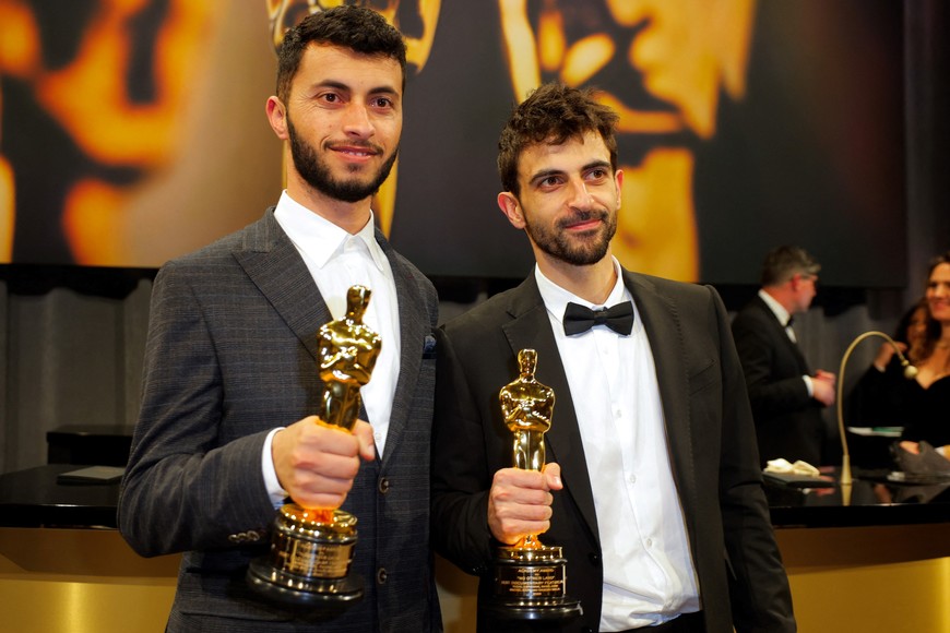 Basel Adra and Yuval Abraham pose with the Oscar for Best Documentary Feature Film for "No Other Land" at the Governors Ball following the Oscars show at the 97th Academy Awards in Hollywood, Los Angeles, California, U.S., March 2, 2025. REUTERS/Mike Blake