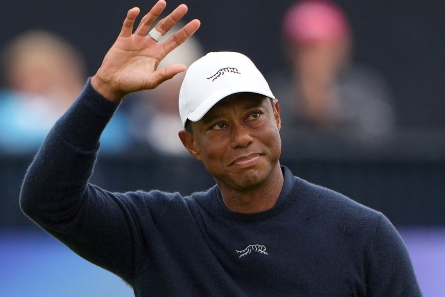 FILE PHOTO: Golf - The 152nd Open Championship - Royal Troon Golf Club, Troon, Scotland, Britain - July 19, 2024
Tiger Woods of the U.S. acknowledges the crowd at the 18th green after finishing his second round REUTERS/Maja Smiejkowska/File Photo