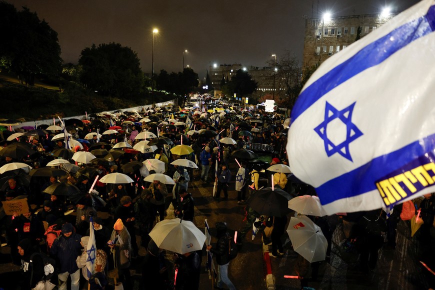 People take part in a rally against the Israeli government and Israeli Prime Minister Benjamin Netanyahu, and demanding the release of all hostages from Gaza, outside the Knesset, the Israeli parliament, in Jerusalem, March 20, 2025. REUTERS/Ammar Awad
