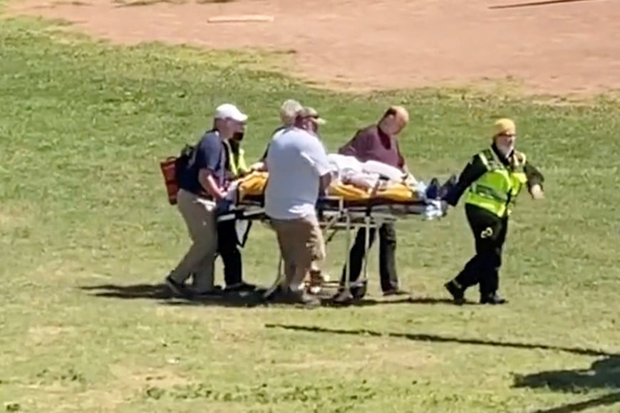 Author Salman Rushdie is transported to a helicopter after he was stabbed on stage before his scheduled speech at the Chautauqua Institution, Chautauqua, New York, U.S., August 12, 2022, in this screengrab taken from a social media video. TWITTER @HoratioGates3 /via REUTERS THIS IMAGE HAS BEEN SUPPLIED BY A THIRD PARTY. MANDATORY CREDIT.