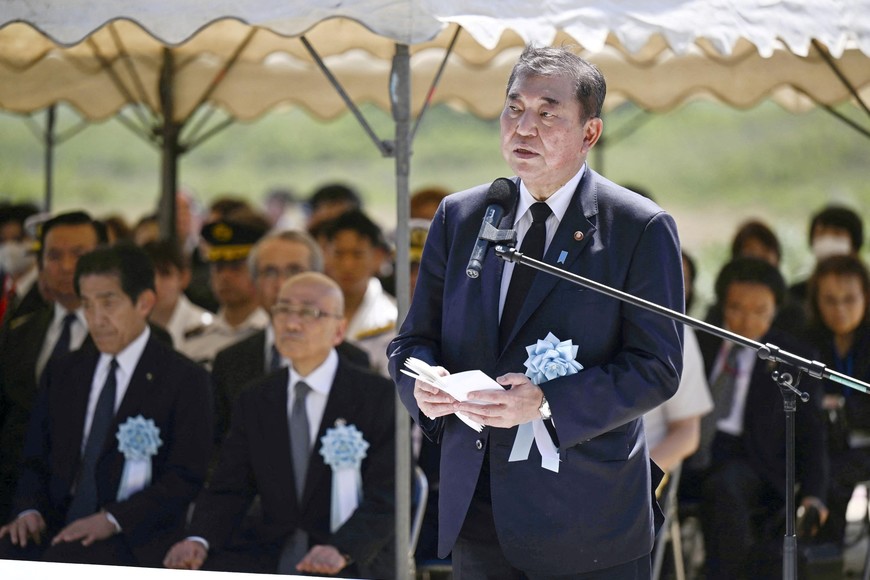 Japan's Prime Minister Shigeru Ishiba delivers a speech during a memorial service jointly held by Japan and the United States to mark the 80th anniversary of one of World War Two's deadliest and most symbolic battles on the remote island of Iwo Jima, which is now officially called Iwo To in Japan, March 29, 2025, in this photo released by Kyodo. Kyodo/via REUTERS ATTENTION EDITORS - THIS IMAGE HAS BEEN SUPPLIED BY A THIRD PARTY. MANDATORY CREDIT. JAPAN OUT. NO COMMERCIAL OR EDITORIAL SALES IN JAPAN.