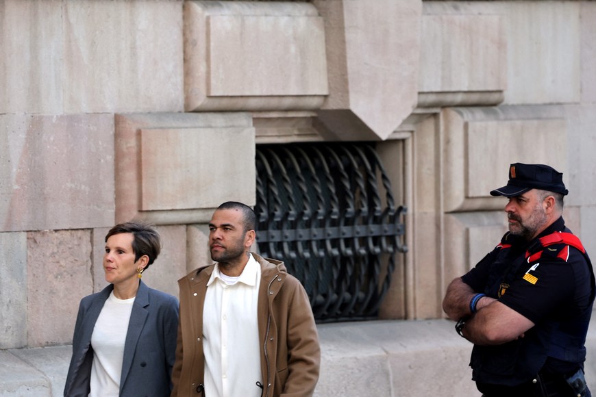 Brazilian soccer player Dani Alves arrives with his lawyer Ines Guardiola to appear in court after he was released from prison on bail in Barcelona, Spain, March 28, 2024. REUTERS/Nacho Doce