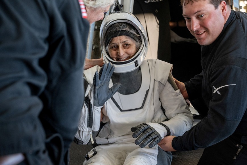 NASA astronaut Suni Williams is helped out of a SpaceX Dragon spacecraft onboard the SpaceX recovery ship MEGAN after she, NASA astronaut Nick Hague, and Butch Wilmore, and Roscosmos cosmonaut Aleksandr Gorbunov landed in the water off the coast of Tallahassee, Florida, Tuesday, March 18, 2025. NASA/Keegan Barber/ Handout via REUTERS