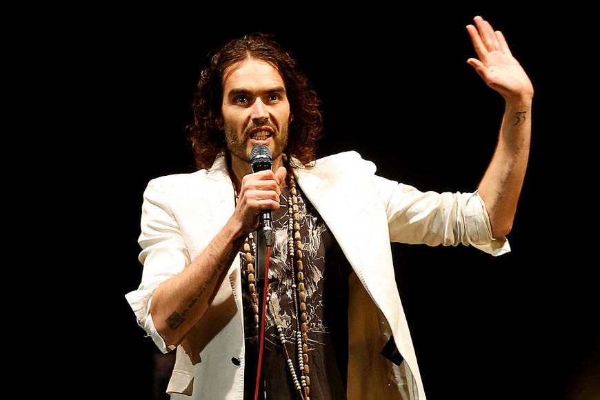FILE PHOTO: British comedian Russell Brand performs at his Messiah Complex show at Brixton Academy in London March 9, 2014. REUTERS/Olivia Harris/File Photo