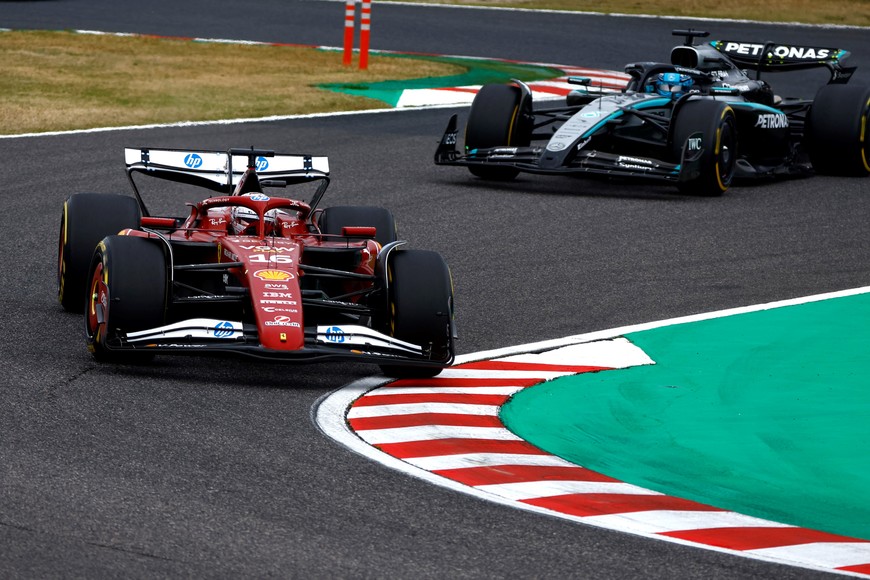 Formula One F1 - Japanese Grand Prix - Suzuka Circuit, Suzuka, Japan - April 6, 2025
Ferrari's Charles Leclerc and Mercedes' George Russell in action during the race REUTERS/Manami Yamada