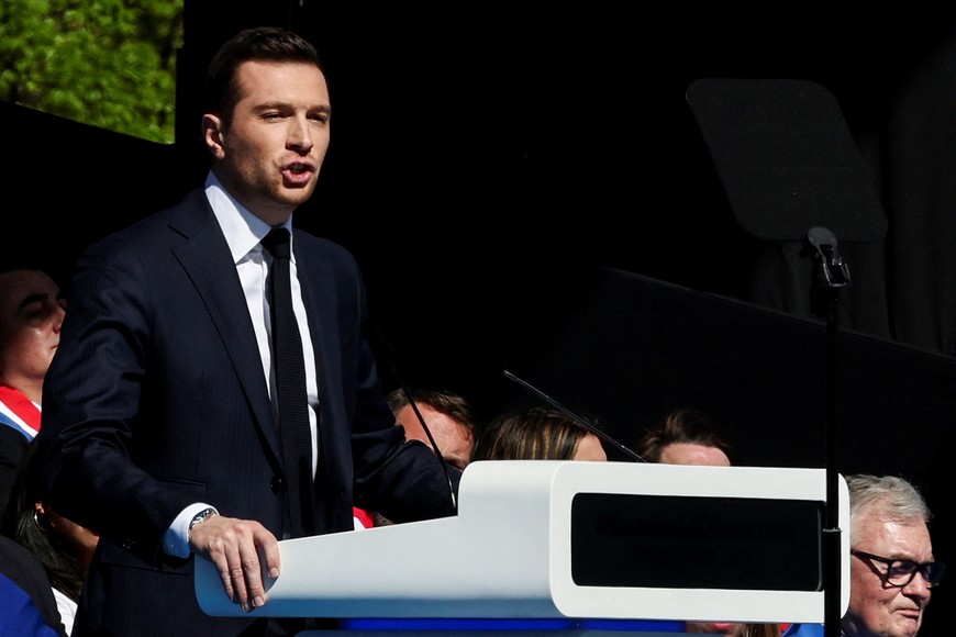 Jordan Bardella, president of the French far-right National Rally (Rassemblement National - RN) political party, delivers a speech during a rally in support of French far-right leader Marine Le Pen in Paris, after calling for a peaceful mobilisation following Marine Le Pen's conviction for embezzlement of EU funds, resulting in her being barred from running for office for five years, France, April 6, 2025. REUTERS/Gonzalo Fuentes