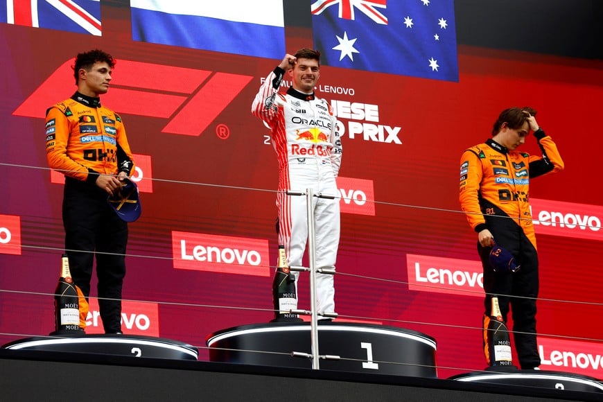 Formula One F1 - Japanese Grand Prix - Suzuka Circuit, Suzuka, Japan - April 6, 2025
Red Bull's Max Verstappen celebrates on the podium after winning the Japanese Grand Prix along with second placed McLaren's Lando Norris and third placed McLaren's Oscar Piastri REUTERS/Manami Yamada