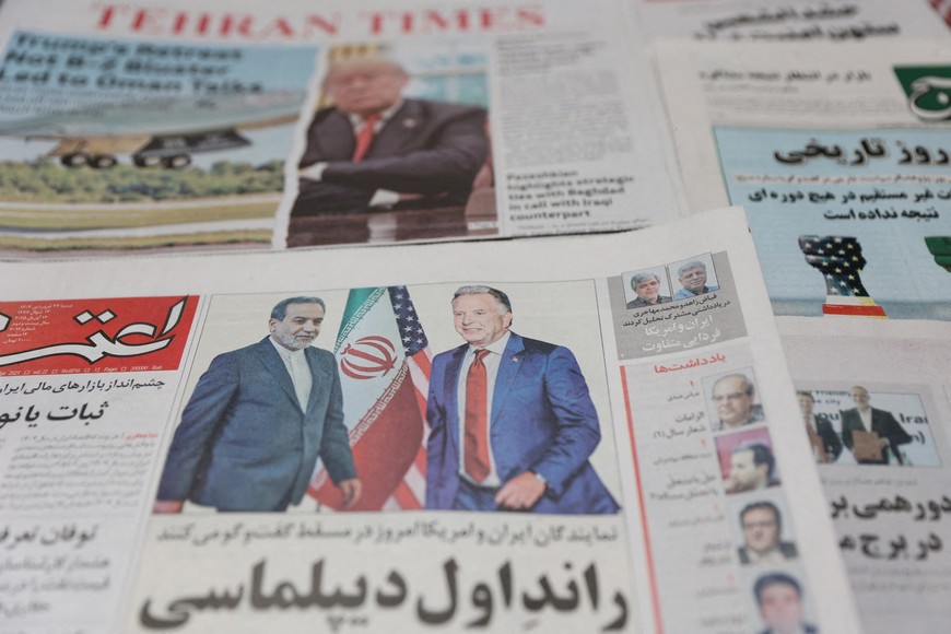 An Iranian newspaper with a cover photo of Iran's Foreign Minister Abbas Araqchi and U.S. Middle East envoy Steve Witkoff, is seen in Tehran, Iran, April 12, 2025. Majid Asgaripour/WANA (West Asia News Agency) via REUTERS   ATTENTION EDITORS - THIS PICTURE WAS PROVIDED BY A THIRD PARTY     TPX IMAGES OF THE DAY