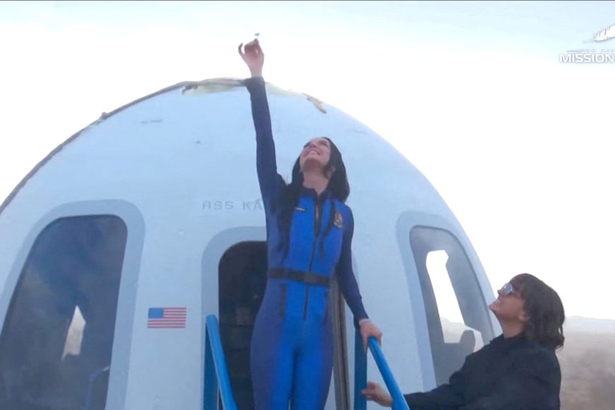 Pop star Katy Perry comes out of the capsule in which she, journalists Gayle King, Lauren Sanchez, who is also billionaire Jeff Bezos' fiance and other participants, landed back on earth after blasting off into space on a Blue Origin rocket, as part of the New Shepard Mission NS-31, marking the first all-female flight crew in more than six decades, in West Texas, Texas, U.S., April 14, 2025, in this screen grab taken from a video. Blue Origin/Handout via REUTERS    THIS IMAGE HAS BEEN SUPPLIED BY A THIRD PARTY. NO RESALES. NO ARCHIVES. MANDATORY CREDIT     TPX IMAGES OF THE DAY