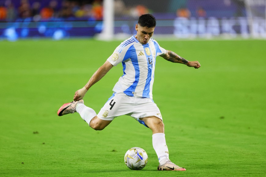 Jul 14, 2024; Miami, FL, USA; Argentina defender Gonzalo Montiel (4) delivers a cross against Colombia during the first half of the Copa America final at Hard Rock Stadium. Mandatory Credit: Sam Navarro-USA TODAY Sports