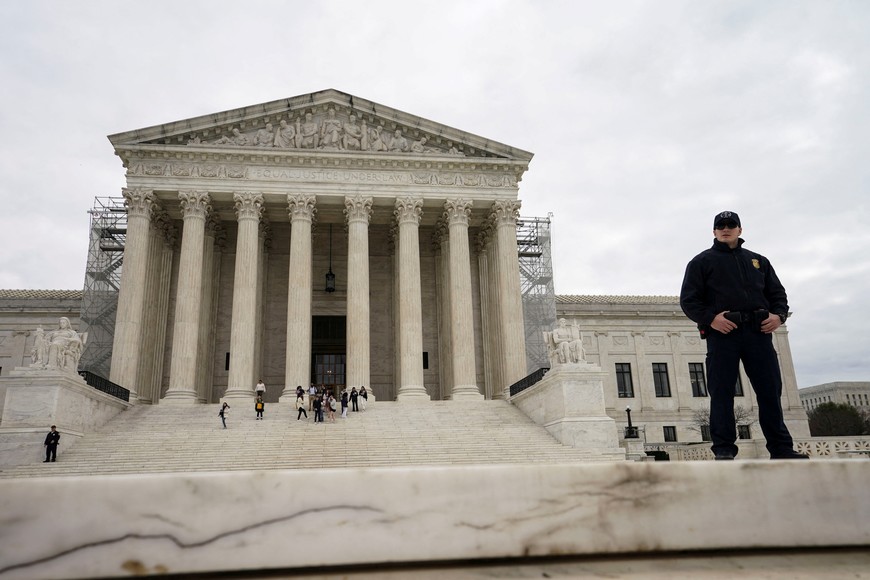 A Supreme Court police officer stands outside the United States Supreme Court building after justices unanimously reversed a Dec. 19, 2023 decision by Colorado's top court to kick Donald Trump off the state's Republican primary ballot, in Washington, U.S., March 4, 2024. REUTERS/Kevin Lamarque