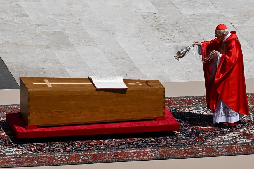 Cardinal Giovanni Battista Re blesses the coffin as he leads the funeral Mass of Pope Francis, in Saint Peter's Square, at the Vatican, April 26, 2025. REUTERS/Dylan Martinez