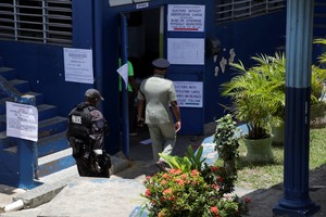 Police officers guard a polling station during the House of Representatives election, in Port of Spain, Trinidad and Tobago April 28, 2025. REUTERS/Andrea de Silva
