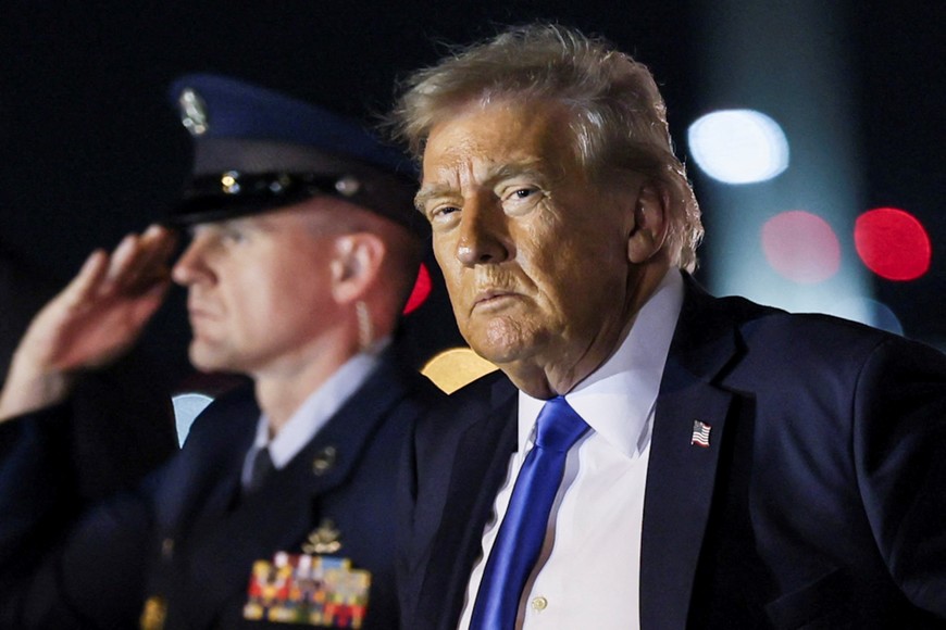U.S. President Donald Trump looks on after disembarking from Air Force One at Palm Beach International Airport, West Palm Beach, Florida, U.S. May 1, 2025. REUTERS/Leah Millis