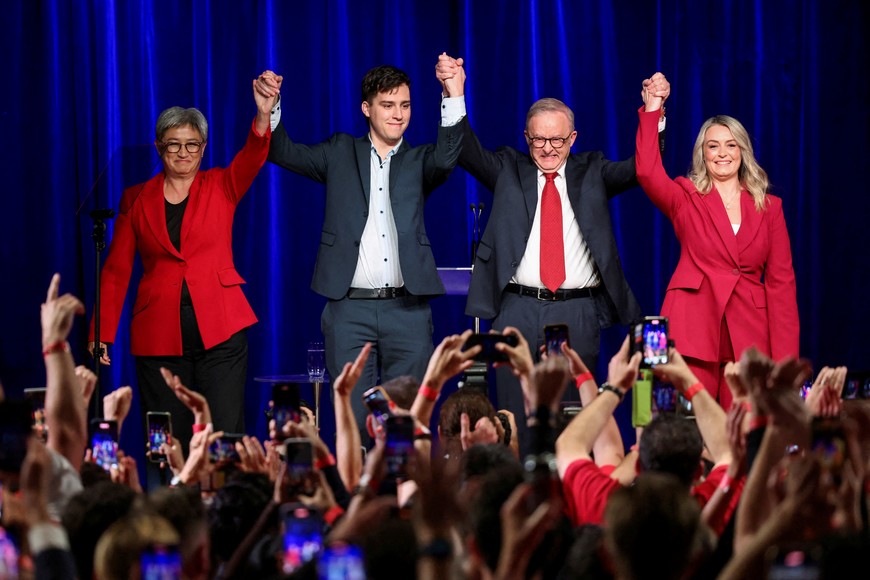 Australia's Prime Minister Anthony Albanese celebrates with his partner Jodie Haydon, his son Nathan Albanese and Minister for Foreign Affairs Penny Wong at a Labor party election night event, after local media projected the Labor Party's victory, on the day of the Australian federal election, in Sydney, Australia, May 3, 2025. REUTERS/Hollie Adams          TPX IMAGES OF THE DAY