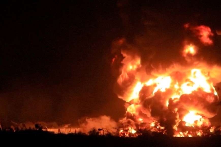 Smoke rises as huge fire erupted at a cement factory in Yemen after the Israeli military said it carried out airstrikes against Hodeidah Port and its vicinity, a day after the Iran-aligned Houthis fired a missile that struck near Israel's main airport, at a location given as Bajil District, Hodeidah Governate, Yemen, in this screengrab obtained from a video released on May 6, 2025.  AL-MASIRAH TV/Handout via REUTERS    THIS IMAGE HAS BEEN SUPPLIED BY A THIRD PARTY NO RESALES. NO ARCHIVES