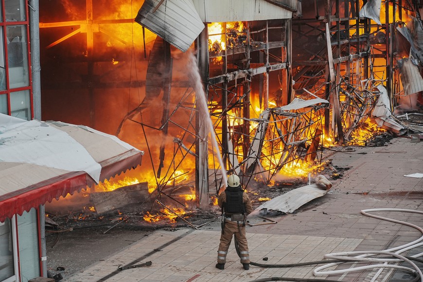 A firefighter works at the site of the Barabashovo market hit by Russian drone strike, amid Russia's attack on Ukraine, in Kharkiv, Ukraine May 6, 2025. REUTERS/Viktoriia Yakymenko