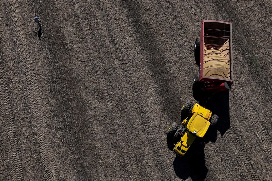 A drone view shows a harvester working in a soybean plantation in San Andres de Giles, on the outskirts of Buenos Aires, Argentina, May 12, 2025. REUTERS/Martin Cossarini