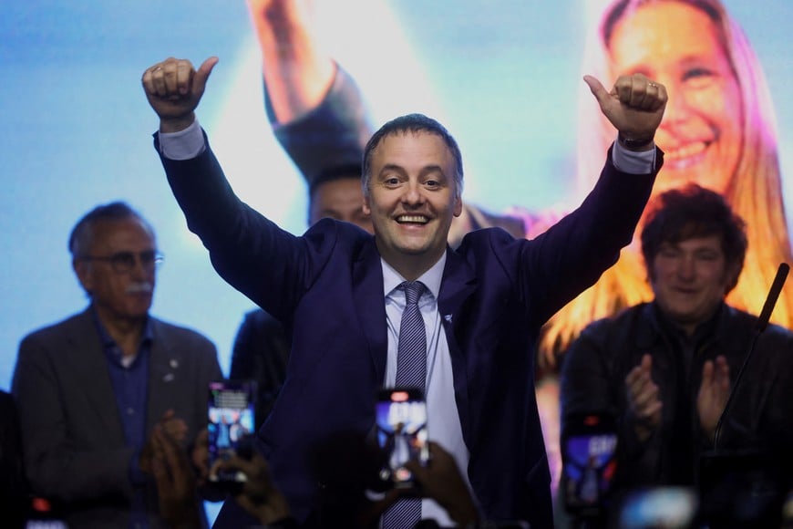 Presidential spokesman and legislative candidate in the city of Buenos Aires Manuel Adorni celebrates onstage at the La Libertad Avanza party headquarters on the day of the legislative elections of the city of Buenos Aires, Argentina, May 18, 2025. REUTERS/Tomas Cuesta