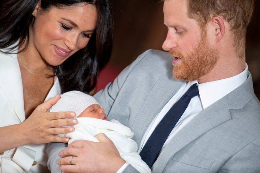 FILE PHOTO: Britain's Prince Harry and Meghan, Duchess of Sussex hold their baby son, who was born on Monday morning, during a photocall in St George's Hall at Windsor Castle, in Berkshire, Britain May 8, 2019. Dominic Lipinski/Pool via REUTERS/File Photo