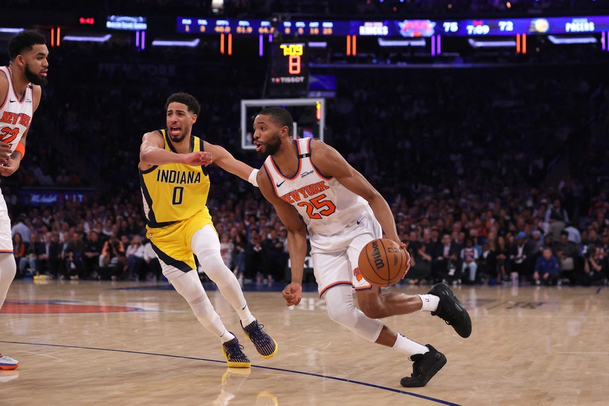 May 21, 2025; New York, New York, USA; New York Knicks forward Mikal Bridges (25) controls the ball against Indiana Pacers guard Tyrese Haliburton (0) in the third quarter during game one of the eastern conference finals for the 2025 NBA Playoffs at Madison Square Garden. Mandatory Credit: Brad Penner-Imagn Images