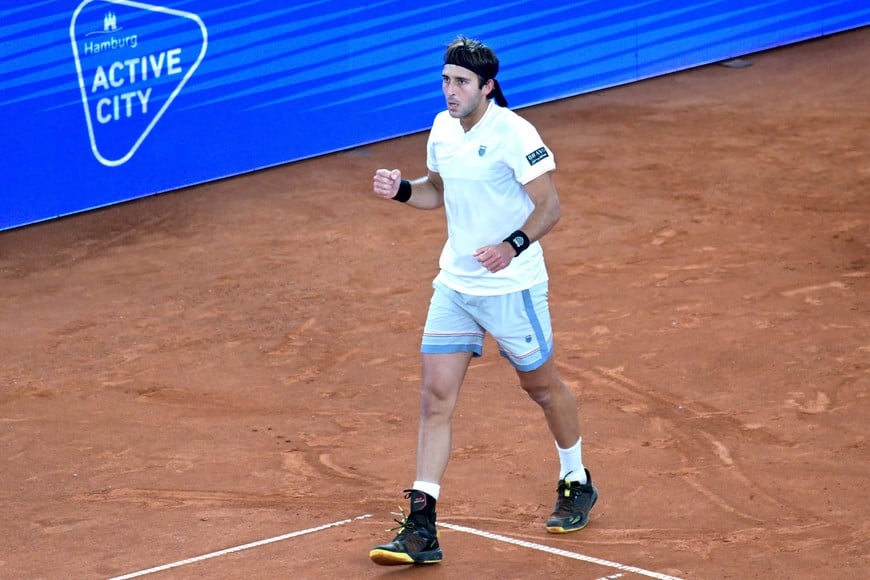 Tennis - Hamburg European Open - Am Rothenbaum, Hamburg, Germany - May 22, 2025
Argentina's Tomas Martin Etcheverry celebrates after winning his quarter final match against Czech Republic's Jiri Lehecka REUTERS/Fabian Bimmer