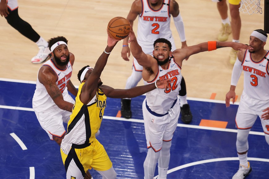 May 21, 2025; New York, New York, USA; New York Knicks center Karl-Anthony Towns (32) defends against Indiana Pacers forward Pascal Siakam (43) in the fourth quarter during game one of the eastern conference finals for the 2025 NBA Playoffs at Madison Square Garden. Mandatory Credit: Brad Penner-Imagn Images