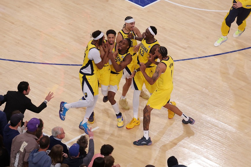 May 21, 2025; New York, New York, USA; Indiana Pacers guard Tyrese Haliburton (0) celebrates with teammates after tying the game in the fourth quarter to send the game to overtime against the New York Knicks during game one of the eastern conference finals for the 2025 NBA Playoffs at Madison Square Garden. Mandatory Credit: Brad Penner-Imagn Images