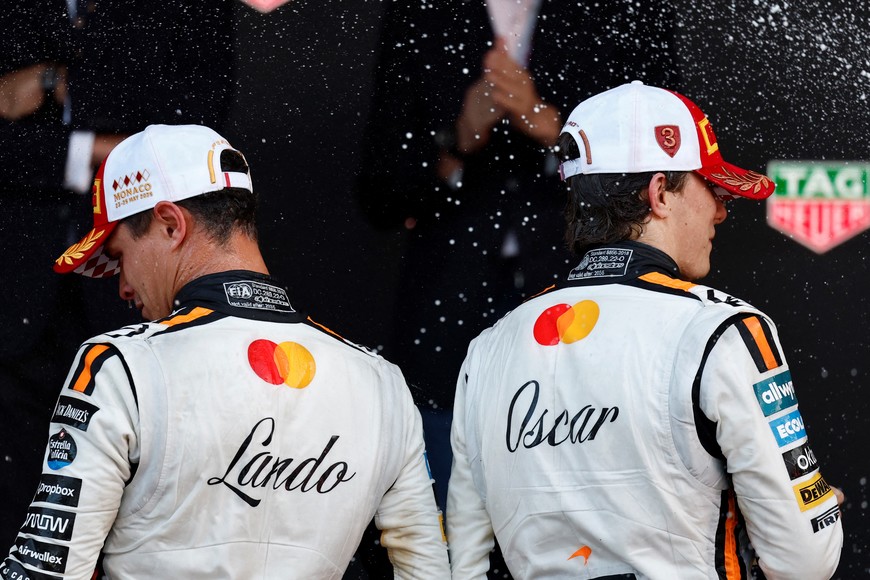 Formula One F1 - Monaco Grand Prix - Circuit de Monaco, Monaco - May 25, 2025
McLaren's Lando Norris celebrates on the podium after winning the Monaco Grand Prix alongside third placed McLaren's Oscar Piastri REUTERS/Stephanie Lecocq