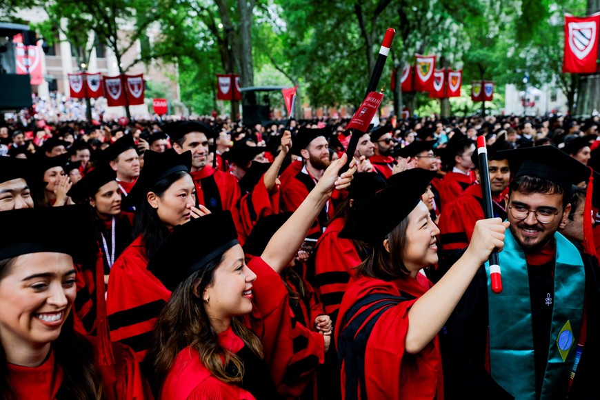 Graduating students cheer for Harvard University President Alan Garber during the 374th Commencement exercises at Harvard University in Cambridge, Massachusetts, U.S., May 29, 2025. REUTERS/Brian Snyder