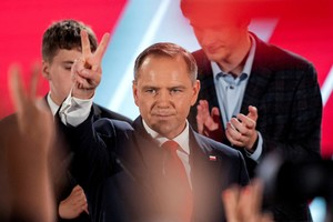 Polish presidential candidate Karol Nawrocki, backed by the main opposition Law and Justice (PiS) party, reacts to the exit polls of the second round of the presidential election, in Warsaw, Poland, June 1, 2025. REUTERS/Aleksandra Szmigiel