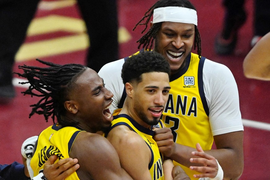 May 6, 2025; Cleveland, Ohio, USA; Indiana Pacers guard Tyrese Haliburton (center) celebrates the game-winning three-point basket with forward Aaron Nesmith (23) and center Myles Turner (33) after game two of the second round of the 2025 NBA Playoffs against the Cleveland Cavaliers at Rocket Arena. Mandatory Credit: David Richard-Imagn Images     TPX IMAGES OF THE DAY