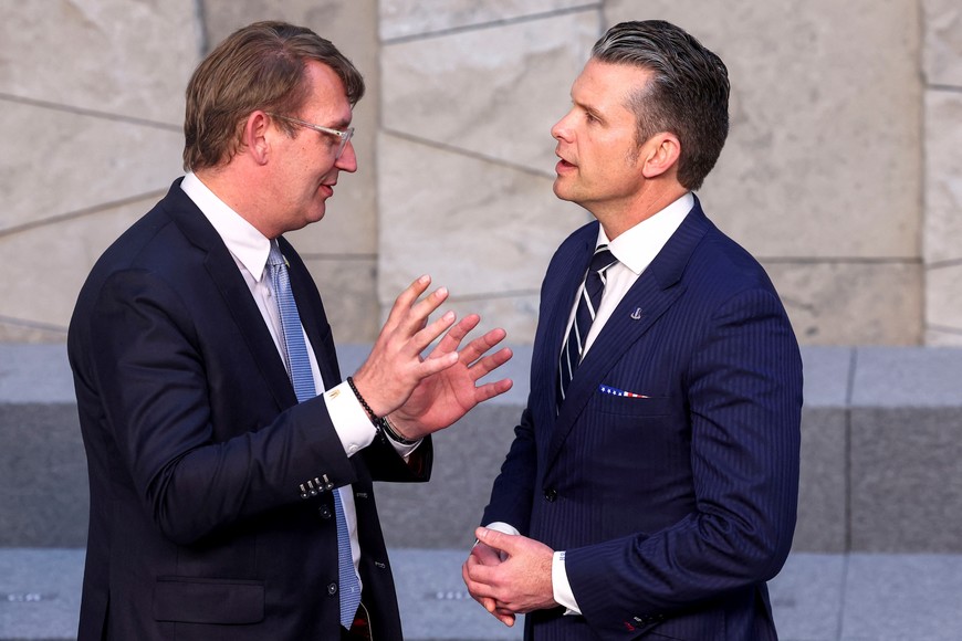 U.S. Defense Secretary Pete Hegseth and Denmark's Defence Minister Troels Lund Poulsen talk before a family photo on the day of a meeting of NATO Defence Ministers at the Alliance headquarters in Brussels, Belgium June 5, 2025. REUTERS/Yves Herman