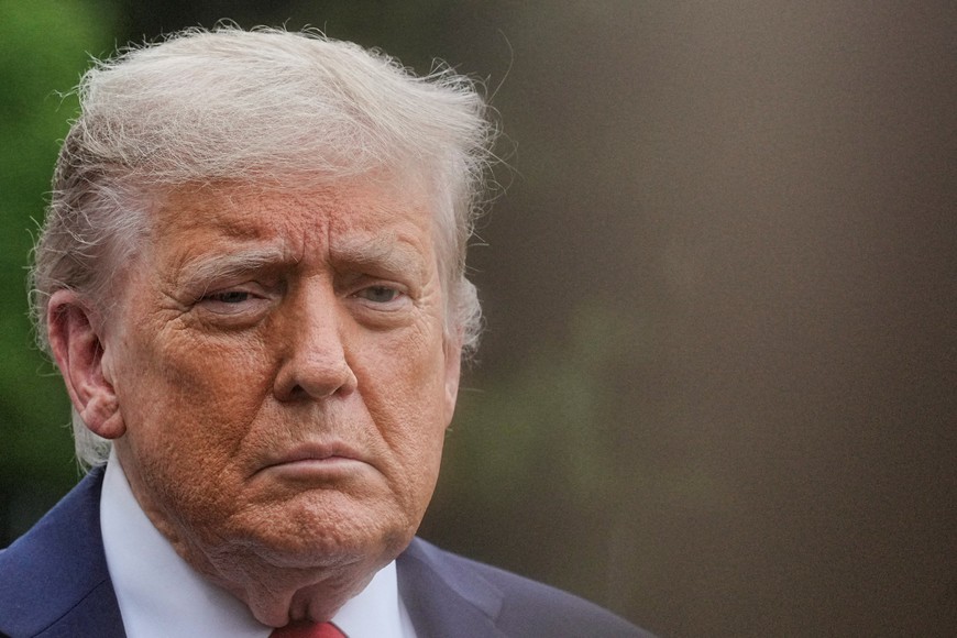 U.S. President Donald Trump looks on as he departs the White House to attend the G7 summit in Canada, in Washington, D.C., U.S., June 15, 2025. REUTERS/Ken Cedeno