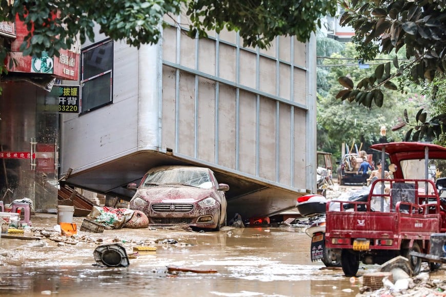 Debris is pictured on a street after floodwaters receded in Rongjiang county, Guizhou province, China June 25, 2025. cnsphoto via REUTERS ATTENTION EDITORS - THIS IMAGE WAS PROVIDED BY A THIRD PARTY. CHINA OUT.