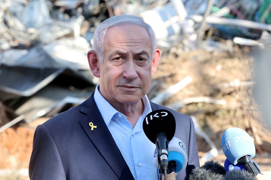 FILE PHOTO: Israel's Prime Minister Benjamin Netanyahu gives a statement during a visit to the site of the Weizmann Institute of Science, which was hit by an Iranian missile barrage, in the central city of Rehovot, Israel June 20, 2025.     JACK GUEZ/Pool via REUTERS/File Photo