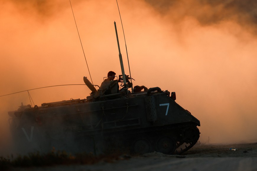 An Israeli military vehicle manoeuvers near the Israel-Gaza Border, as seen from Israel, June 29, 2025. REUTERS/Amir Cohen
