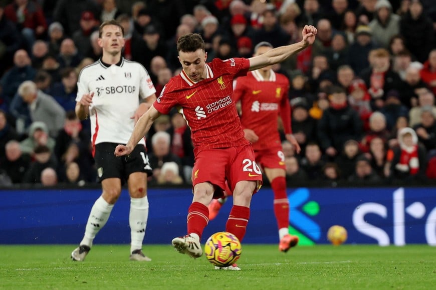 Soccer Football - Premier League - Liverpool v Fulham - Anfield, Liverpool, Britain - December 14, 2024
Liverpool's Diogo Jota scores their second goal REUTERS/Phil Noble EDITORIAL USE ONLY. NO USE WITH UNAUTHORIZED AUDIO, VIDEO, DATA, FIXTURE LISTS, CLUB/LEAGUE LOGOS OR 'LIVE' SERVICES. ONLINE IN-MATCH USE LIMITED TO 120 IMAGES, NO VIDEO EMULATION. NO USE IN BETTING, GAMES OR SINGLE CLUB/LEAGUE/PLAYER PUBLICATIONS. PLEASE CONTACT YOUR ACCOUNT REPRESENTATIVE FOR FURTHER DETAILS..