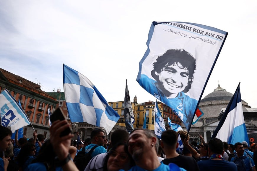 Soccer Football - Serie A - Napoli fans gather before Napoli v Cagliari - Naples, Italy - May 23, 2025
A flag with the image of former player Diego Maradona is seen as fans gather in Naples before the match REUTERS/Yara Nardi