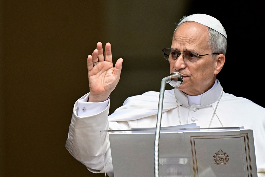 Pope Leo XIV blesses the crowd during the Angelus prayer in Piazza della Liberta (Liberty Square) in front of Palazzo Apostolico (Apostolic Palace) in the summer papal estate in Castel Gandolfo, near Rome, Italy, July 13, 2025. The newly elected pope, takes a summer break from July 6 to 20 at the papal palace, a longtime country residence for pontiffs that Francis declined to use. Tiziana Fabi/Pool via REUTERS